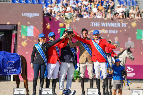 Dava Pala / Italy on the podium with trophy in warsaw